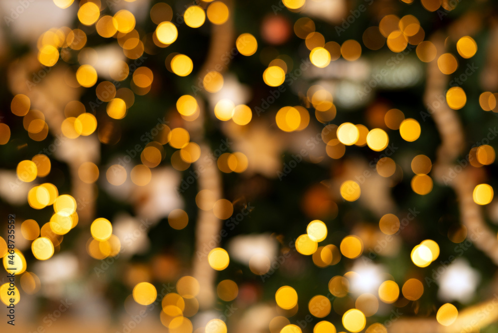 Defocused gold abstract christmas background. Texture Bokeh. 2022 New year 