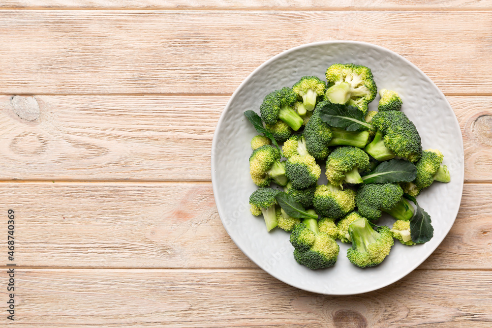broccoli of fresh green broccoli in bowl over coloredbackground. , close up. Fresh vegetable broccoli of fresh green broccoli in bowl over coloredbackground. , close up. Fresh vegetable