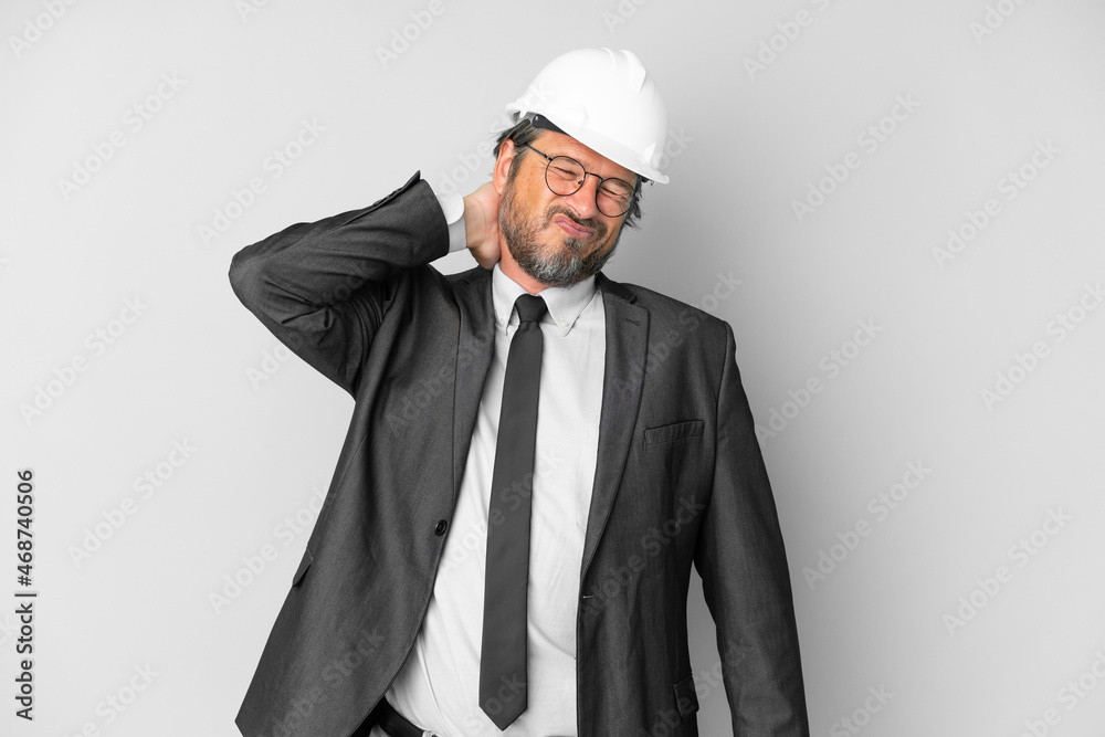 Young architect man with helmet over isolated background with neckache Young architect man with helmet over isolated background with neckache