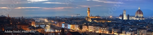 Cityscape of Florence at evening with Old Bridge, Palace of Townhall, Cathedral of Santa Maria del Fiore illuminated during Christmas period. Italy.