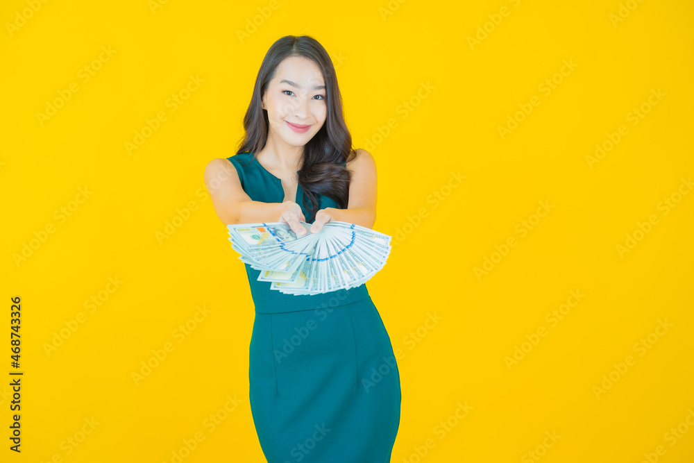 Portrait beautiful young asian woman smile with a lot of cash and money Portrait beautiful young asian woman smile with a lot of cash and money