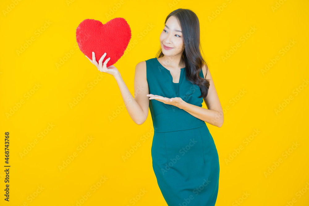 Portrait beautiful young asian woman smile with heart pillow shape Portrait beautiful young asian woman smile with heart pillow shape