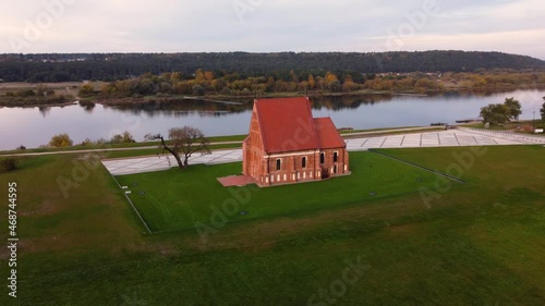 A 4K aerial view of a church in Zapyskis, Lithuania, on the Neman's riverbank photo