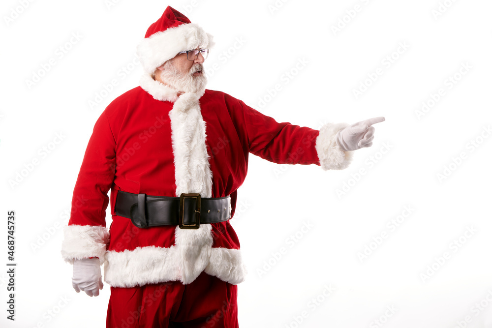 Santa Claus pointing his finger at blank billboard Santa Claus pointing his finger at blank billboard