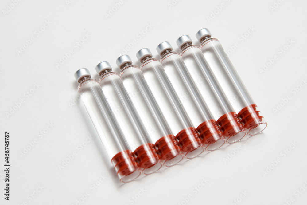Medical vaccine ampoules on white background Medical vaccine ampoules on white background