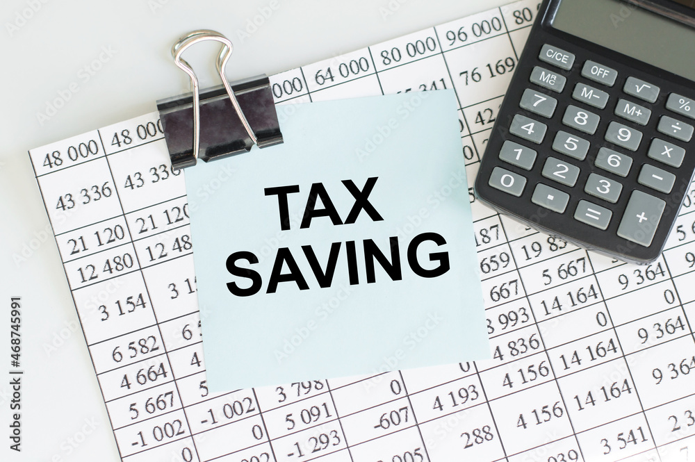 a card with text TAX BENEFITS with a clip on paper on the table, business concept a card with text TAX BENEFITS with a clip on paper on the table, business concept