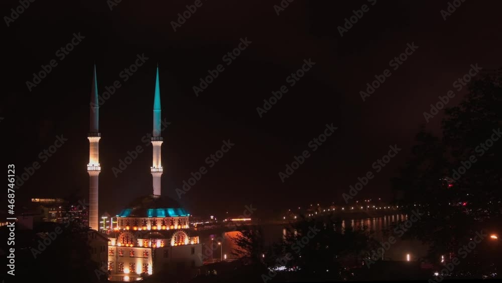 Static view beautiful architecture Uzungol mosque at night with city view. Famous travel and tourism destination Turkey