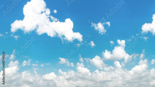 Blue and cyan gradient coloured sky and white clouds floating on air. Astonishing view of harmony of cumulus and clear sky.