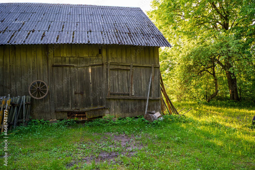 old countryside barn from wooden planks and concrete in rural area old countryside barn from wooden planks and concrete in rural area