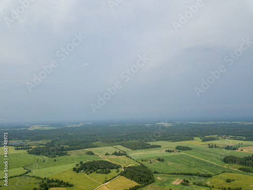countryside fields and roads under cloudy sky