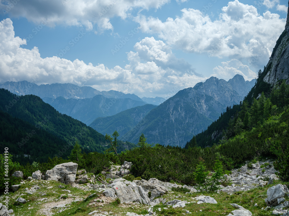 summer mountain tops and peaks under blue cloudy sky in Slovenia national Triglav park summer mountain tops and peaks under blue cloudy sky in Slovenia national Triglav park