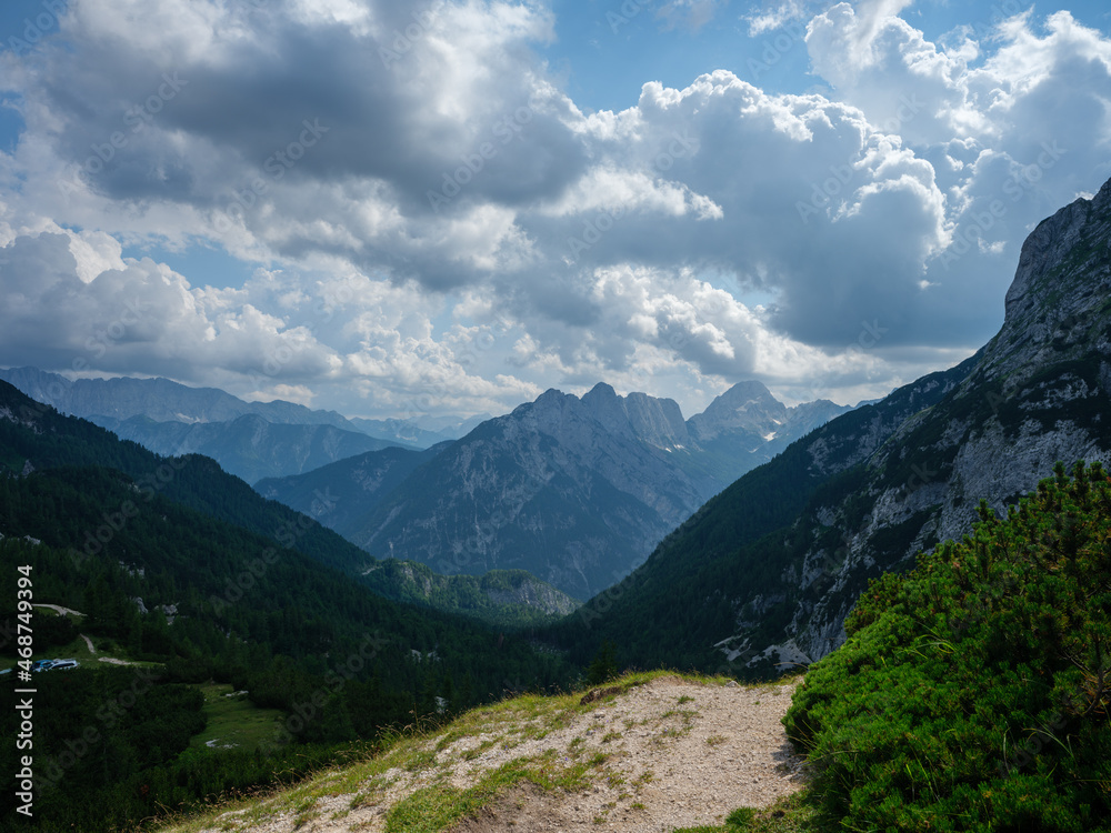 summer mountain tops and peaks under blue cloudy sky in Slovenia national Triglav park