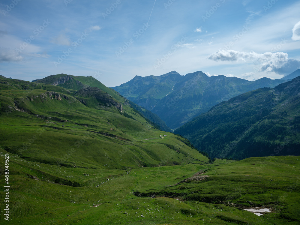 summer green Alps mountains in Austria with snowy peaks