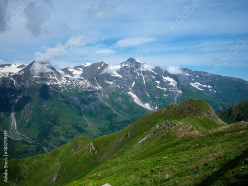 summer green Alps mountains in Austria with snowy peaks