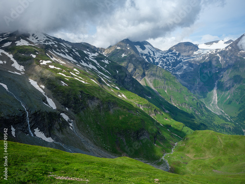 summer green Alps mountains in Austria with snowy peaks