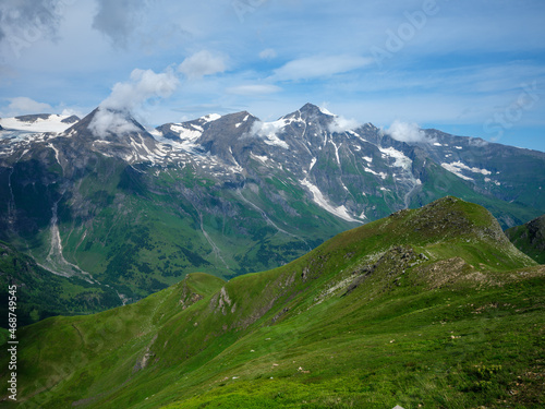 summer green Alps mountains in Austria with snowy peaks