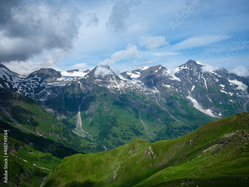 summer green Alps mountains in Austria with snowy peaks