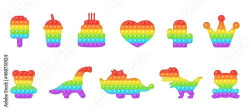 Set of birthday and dinosaur forms pop it a trendy rainbow fidget toys. Addictive anti stress toy in bright colors. Bubble sensory fashionable popit for kids. Vector illustration isolated on a white.