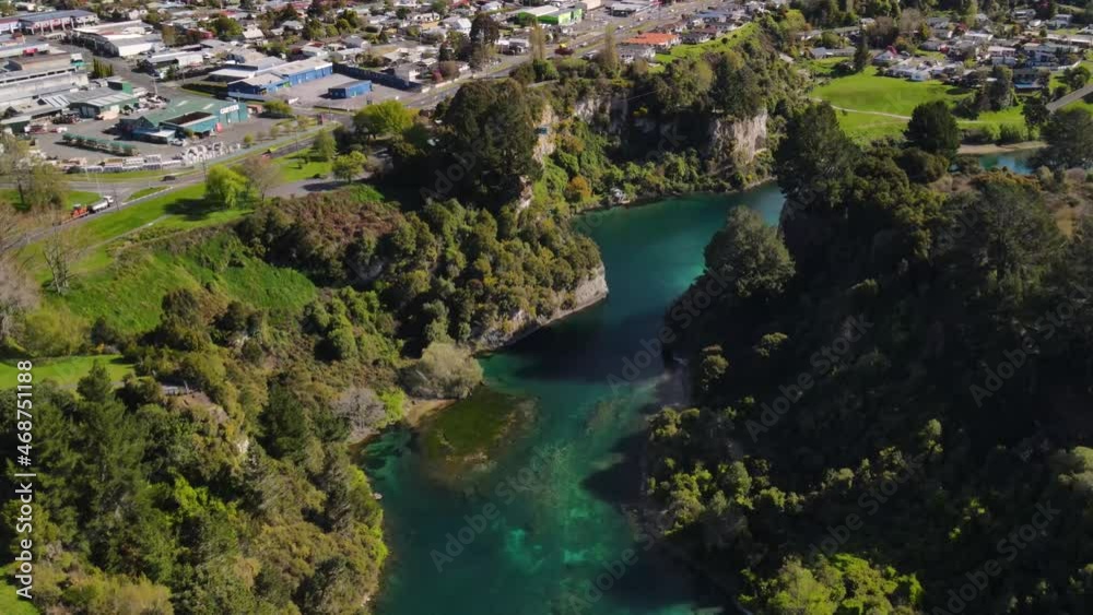 Waikato river in Taupo. Aerial reveal of cityscape and lake. Beautiful sunny day in New Zealand Waikato river in Taupo. Aerial reveal of cityscape and lake. Beautiful sunny day in New Zealand