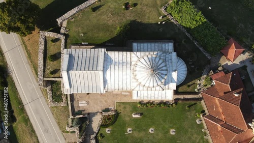 Crkva Svetog Ahilija Arilje, Serbia. Top Down Aerial View, 13th Century Orthodox Church in City Downtown, High Angle Birds Eye Drone Shot photo