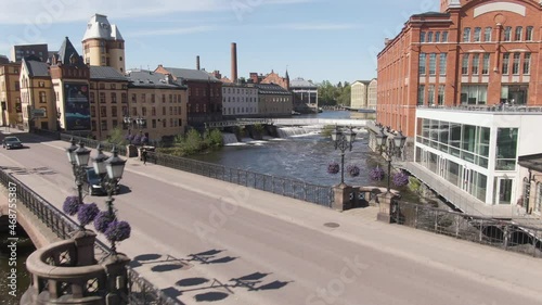 Majestic bridge and river in city of Norrkoping with beautiful old town buildings photo