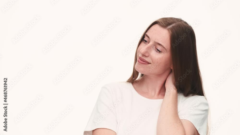 Cheerful woman looking at the camera in white studio Cheerful woman looking at the camera in white studio