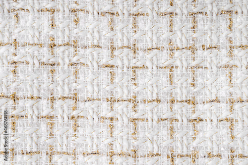 Fabric texture background with golden yarn photo