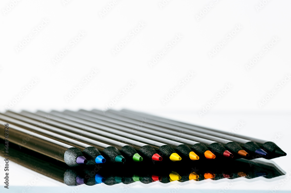 Naklejka premium Black pencils with reflection