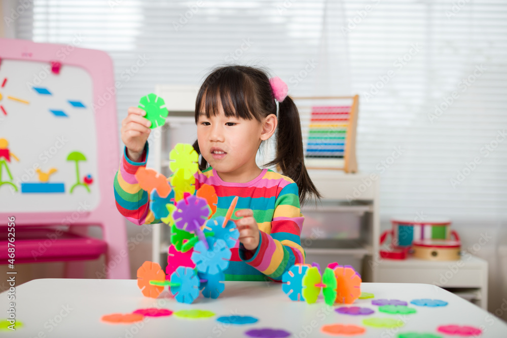 young irl playing creative toy blocks at home young irl playing creative toy blocks at home