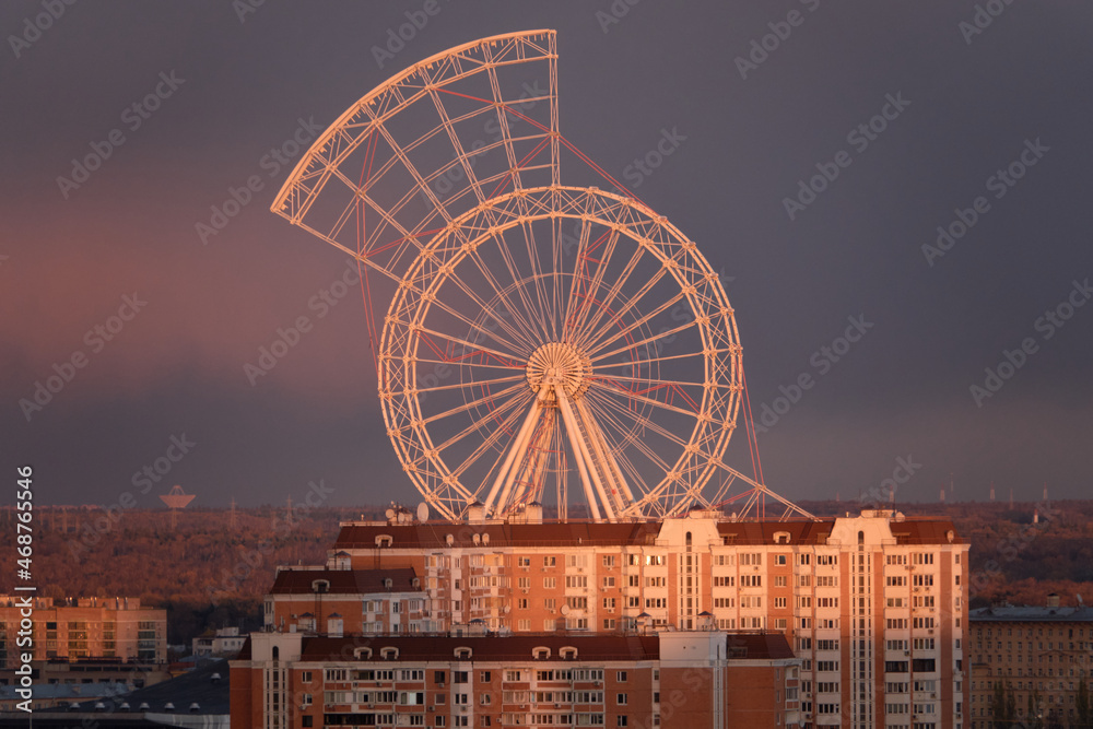 Russia, Moscow, October 24, 2021: View of the main entrance to VDNKh and the construction of the Ferris wheel. Moscow.
