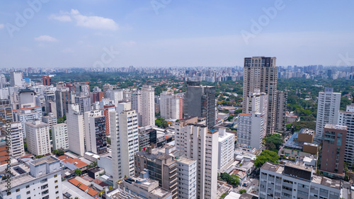 Aerial view of Jardins district in São Paulo, Brazil. Big residential and commercial buildings in a prime area near Av. Paulista with Ibirapuera Park on background. 