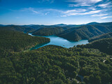 Aerial view of blue lakes and and hills with green forests in Croatia