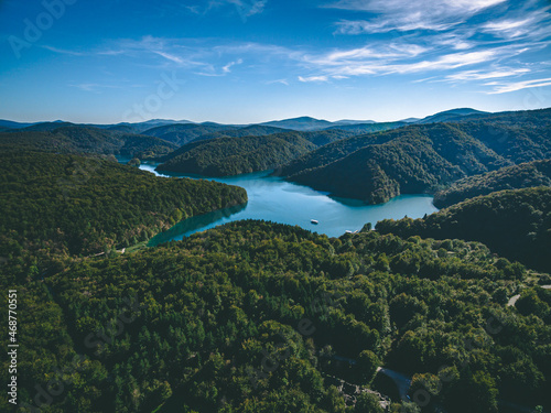 Aerial view of blue lakes and and hills with green forests in Croatia © nblxer