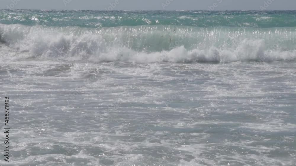 Mediterranean waves coming towards camera in slow motion on Cyprus beach