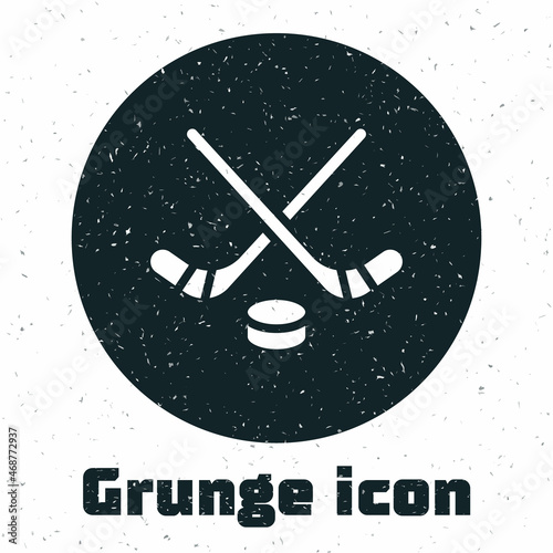 Grunge Ice hockey sticks and puck icon isolated on white background. Game start. Monochrome vintage drawing. Vector