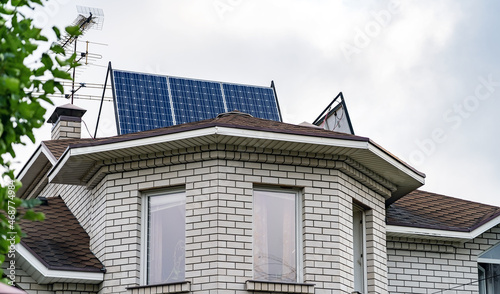 Solar photovoltaic panels on a house roof. Solar energy house company concept image. Solar Panels on Roof of Home