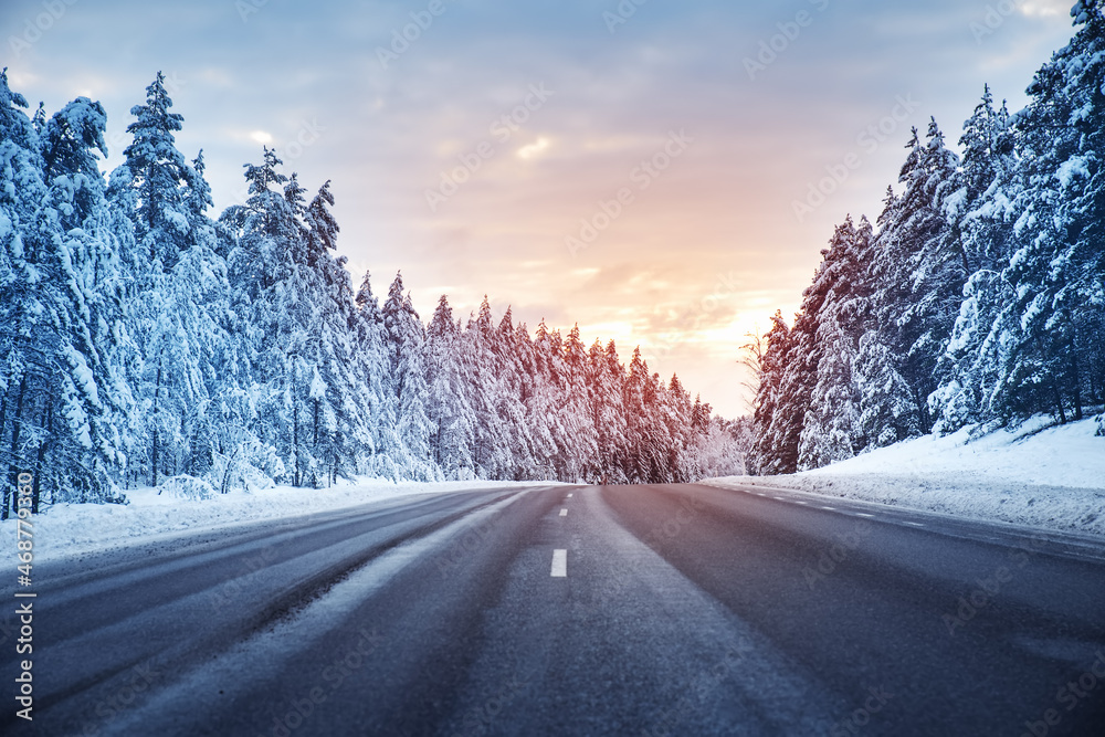 Beautiful view of the snowy curve country road in winter