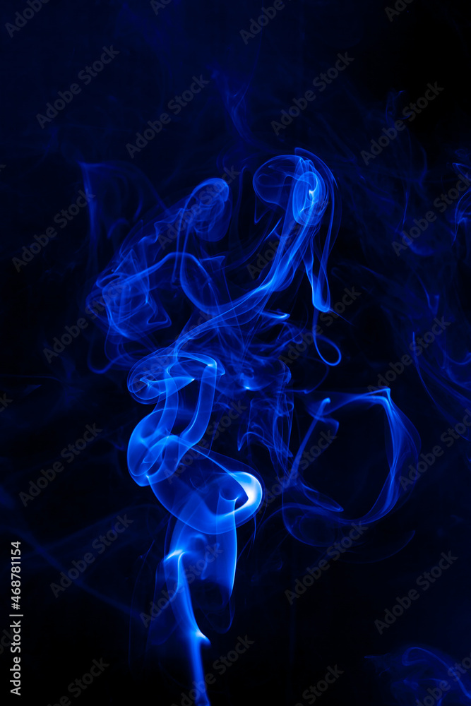 Fototapeta premium Movement blue smoke on black background.