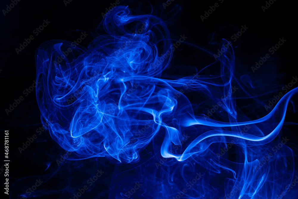 Movement blue smoke on black background.