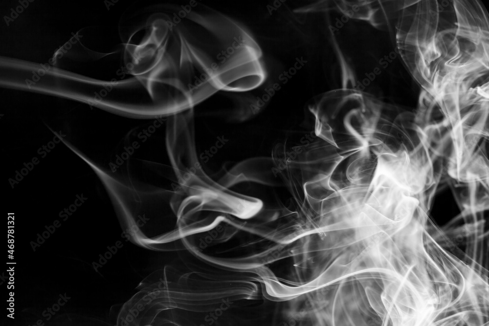 White  smoke motion on black background.