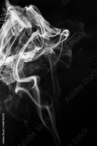 White smoke motion on black background.