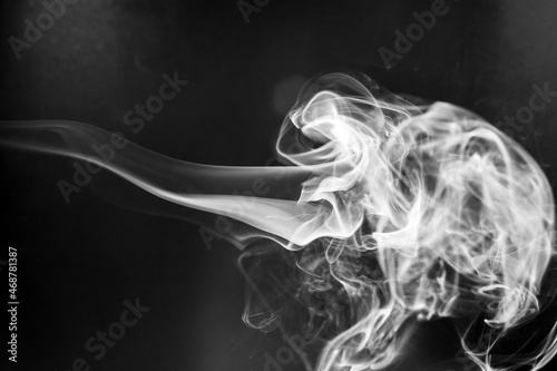 Fototapeta Naklejka Na Ścianę i Meble -  White  smoke motion on black background.