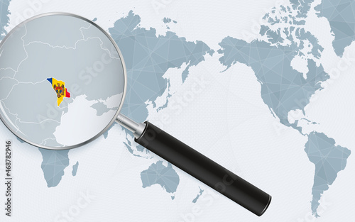 Asia centered world map with magnified glass on Moldova. Focus on map of Moldova on Pacific-centric World Map.