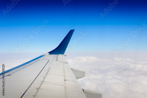 Aircraft wing over clouds