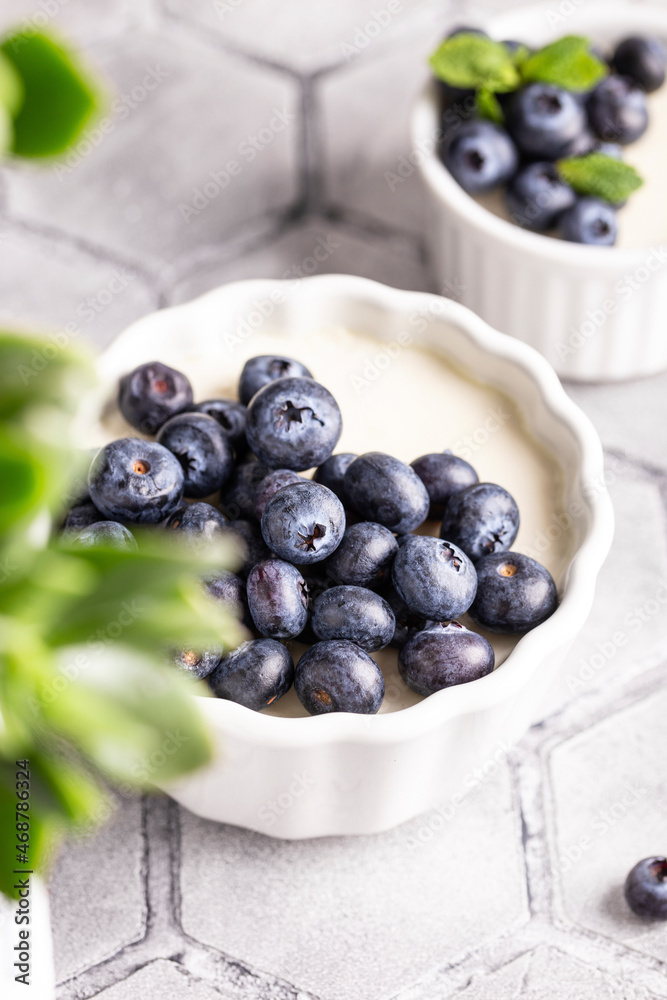 Sweet dessert vanilla panna cotta with blueberries Sweet dessert vanilla panna cotta with blueberries