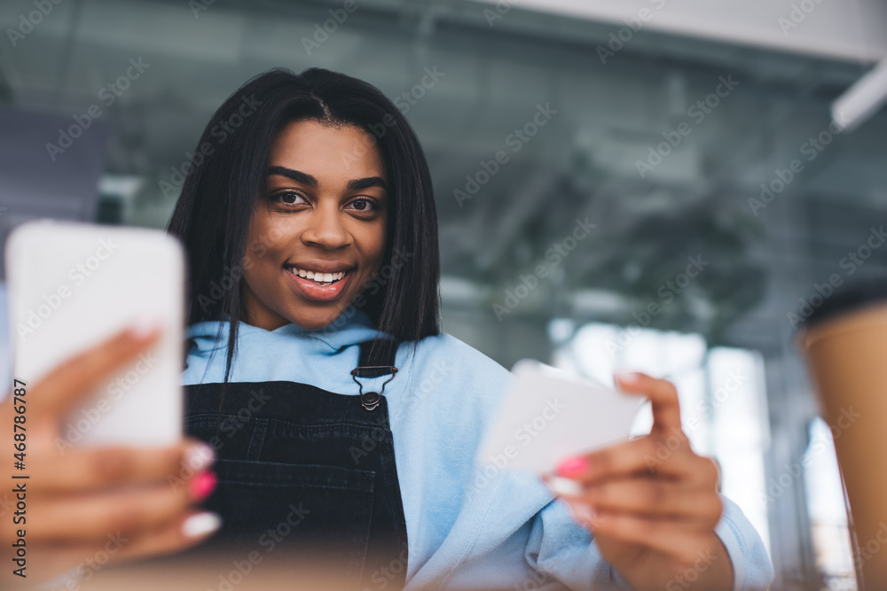 African girl with business card and mobile phone African girl with business card and mobile phone