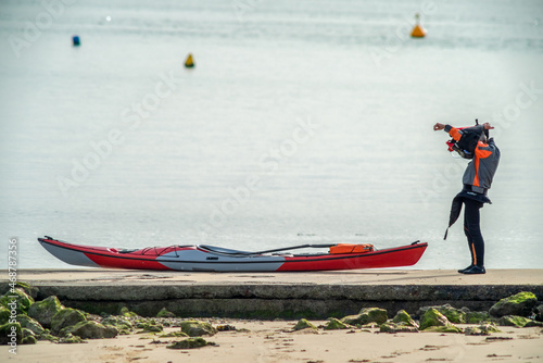Tourist preparing kayak at Oleron Island near La Rochelle on Atlantic coast of Charente Maritime, France  photo