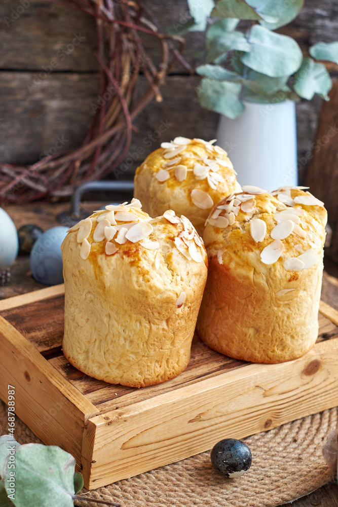 Easter cake with almond chips. Wooden background, side view Easter cake with almond chips. Wooden background, side view