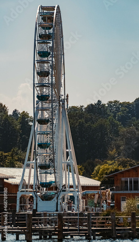 Beautiful alpine summer view with a ferris wheel at the famous Fraueninsel, Chiemsee, Bavaria, Germany