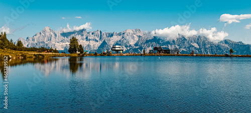 Beautiful alpine summer view with reflections and the famous Dachstein mountains in the background at the Reiteralm, Pichl, Schladming, Steiermark, Austria